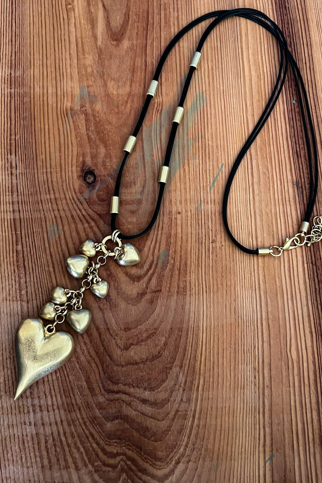 Enchanting Tiered Heart Drop Necklace in Gold Color